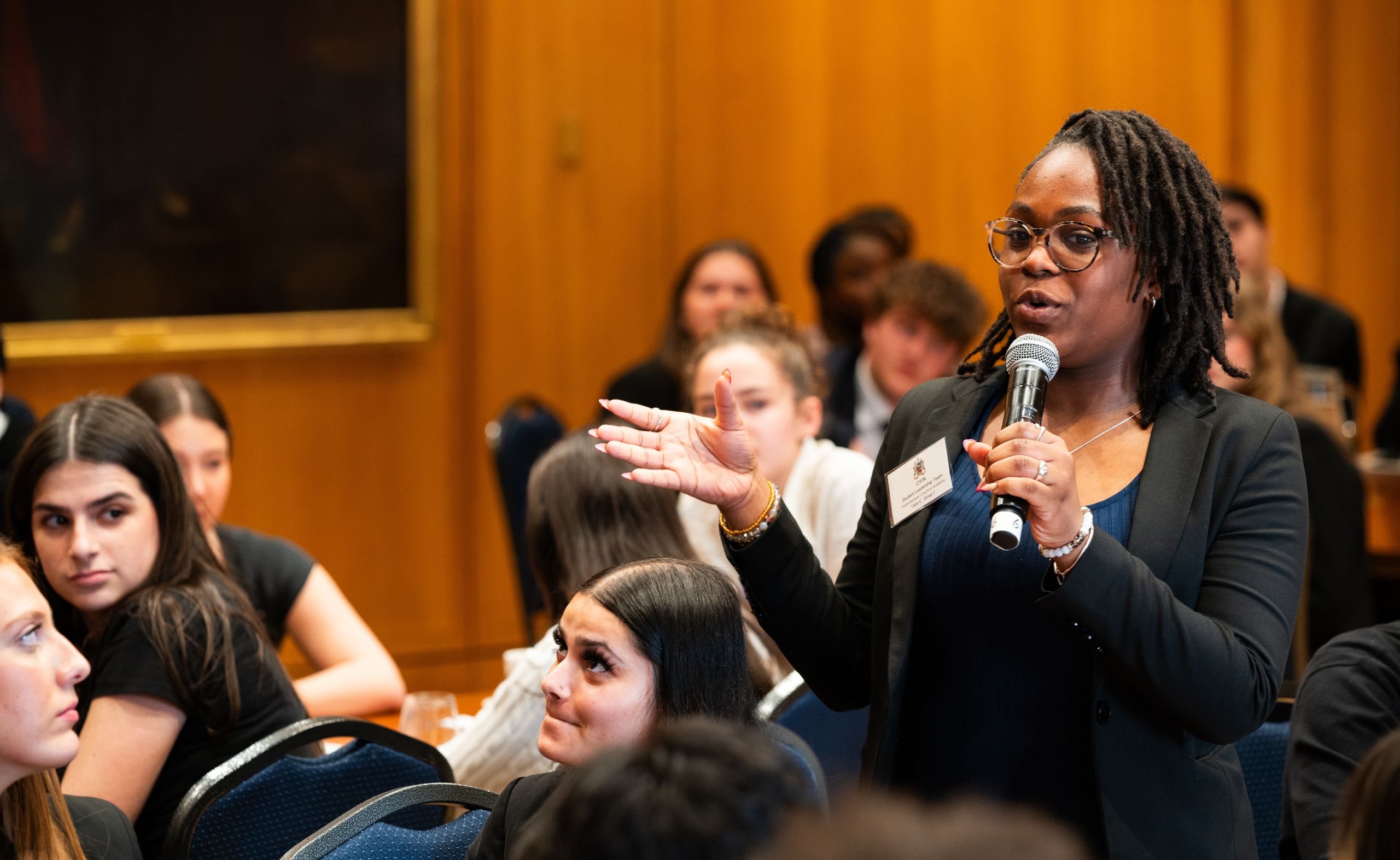 A Year 12 student leader from a Haberdasher school speaks to the room at Haberdashers' Hall