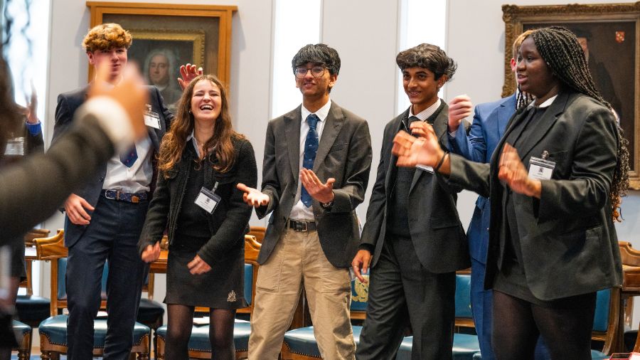 Image shows students practicing their speaking skills
